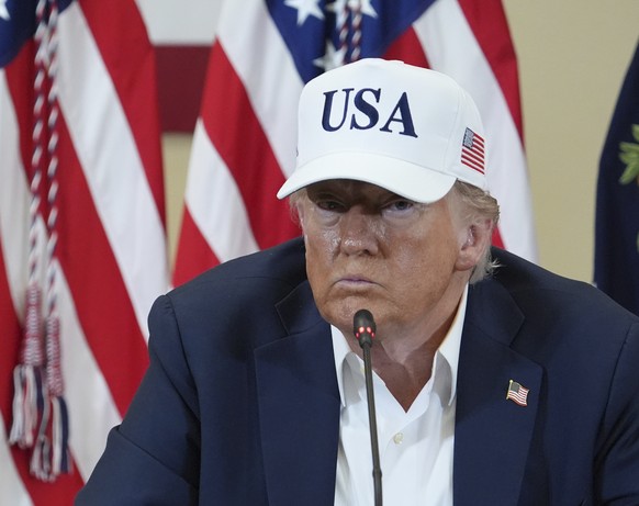 President Donald Trump, right, and first lady Melania Trump listen during a roundtable discussion with first responders and local officials at Hill Country Youth Event Center in Kerrville, Texas, duri ...