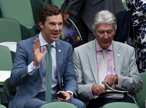 epa04843700 British actor Benedict Cumberbatch (L) and his father Timothy arrive for the final match Novak Djokovic of Serbia against Roger Federer of Switzerland during the Wimbledon Championships at ...