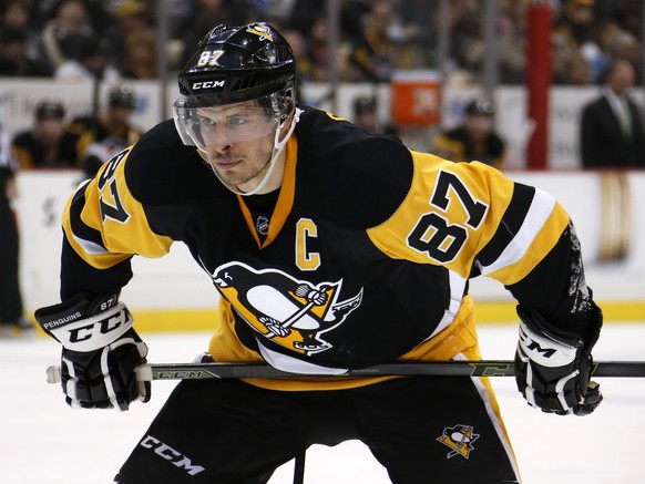 FILE - In this March 20, 2016 file photo, Pittsburgh Penguins center Sidney Crosby (87) lines up to take a face-off during an NHL hockey game against the Washington Capitals in Pittsburgh. After dispa ...