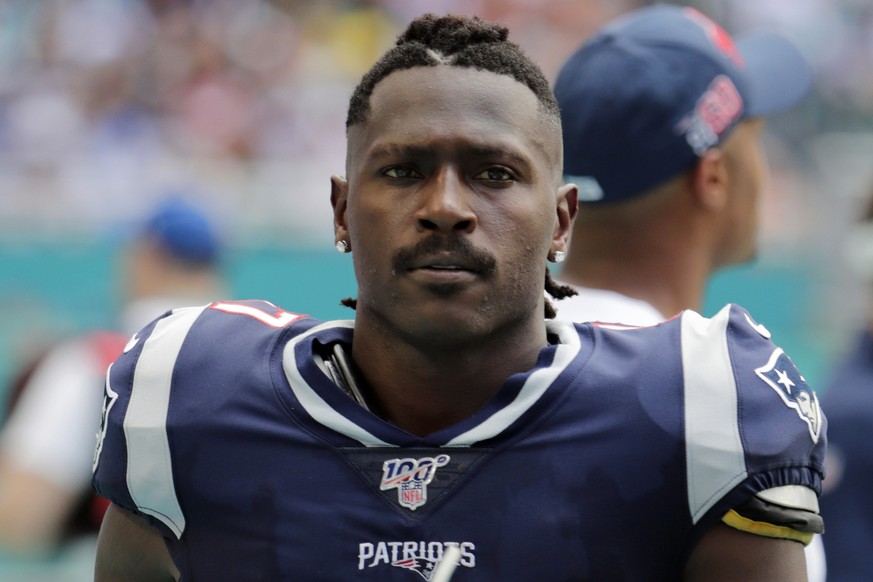 FILE - In this Sunday, Sept. 15, 2019, file photo, New England Patriots wide receiver Antonio Brown (17) on the sidelines,during the first half at an NFL football game against the Miami Dolphins in Mi ...