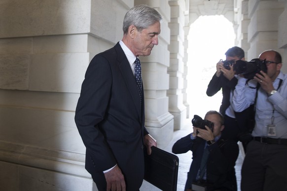 epa07457145 (FILE) - Special Counsel and Former FBI Director Robert Mueller (C) leaves after briefing members of the Senate Judiciary Committee on the investigation into Russia&#039;s interference in  ...