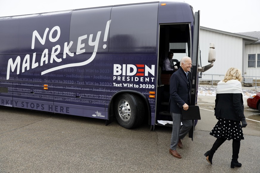 Democratic presidential candidate former Vice President Joe Biden and his wife Jill Biden arrive at a meeting with local residents, Sunday, Dec. 1, 2019, in Carroll, Iowa. (AP Photo/Charlie Neibergall ...