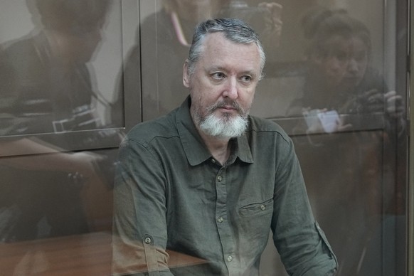 Igor Girkin, also known as Igor Strelkov, the former military chief of the Russian-backed separatists in eastern Ukraine, sits in a glass cage in a courtroom of the Moscow City Court in Moscow, Russia.