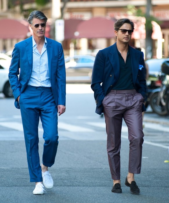 Milan, Italy - 20 June 2016 - men posing for photographers and gives interviews before ARMANI fashion show on Milan Men&#039;s Fashion Week street style