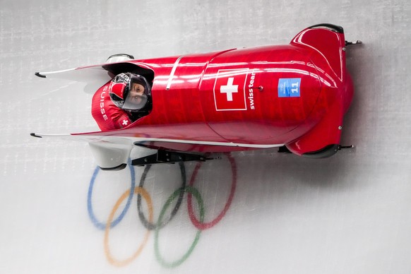 Melanie Hasler and Nadja Pasternack, of Switzerland, slide during the women&#039;s bobsleigh heat 1 at the 2022 Winter Olympics, Friday, Feb. 18, 2022, in the Yanqing district of Beijing. (AP Photo/Dm ...