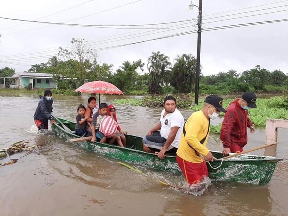 epa08794454 A handout photo made available by the Fire Department of Honduras that shows the rescue work in a flooded area due to Hurricane Eta, in the community of La Masica, Honduras, 02 November 20 ...