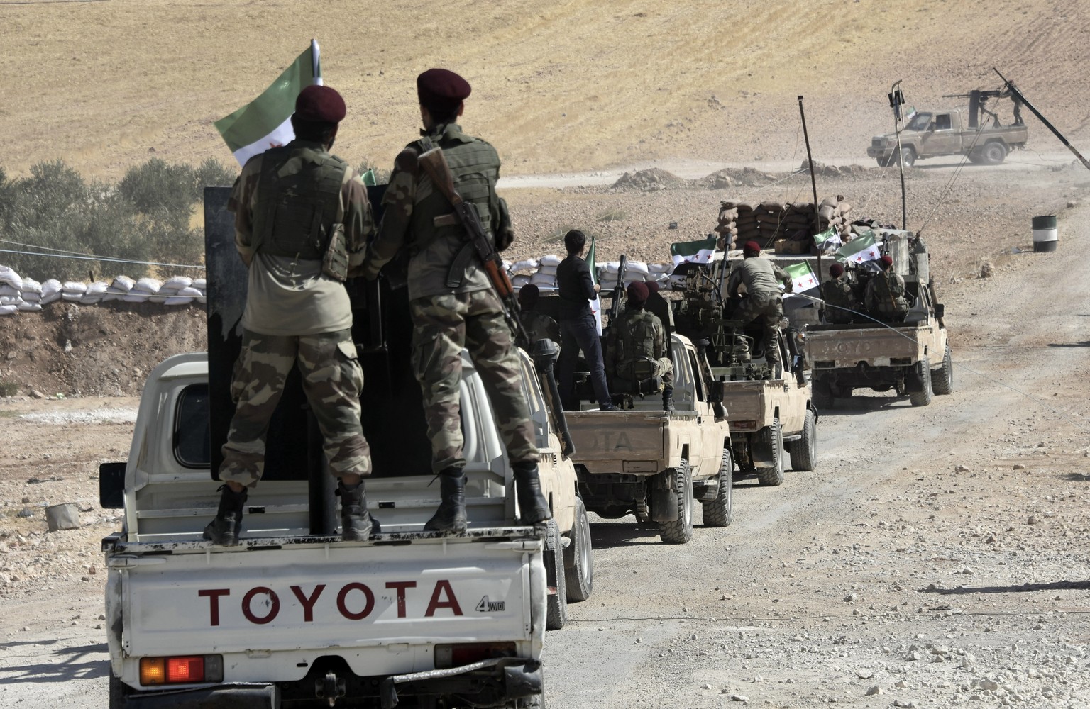 Turkey-backed FSA fighters are heading toward Syrian town of Tal Abyad from Turkish border town of Akcakale, Turkey, Thursday, Oct. 10, 2019. Turkish President Recep Tayyip Erdogan says that there hav ...