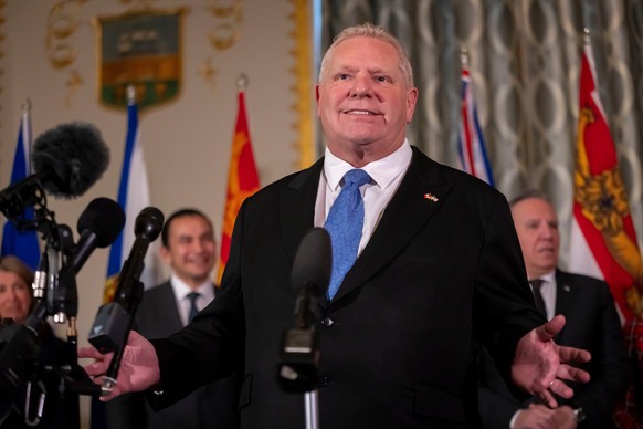 FILE - Premier of Ontario Doug Ford speaks to reporters, accompanied by other Council of the Federation members, at the Mayflower Hotel in Washington, Feb. 12, 2025. (AP Photo/Ben Curtis, file)
US Can ...