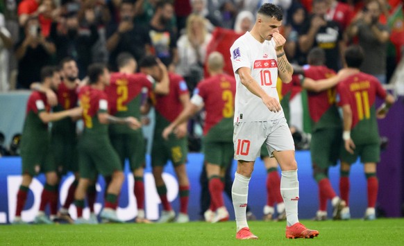 Switzerland's midfielder Granit Xhaka, reacts after the Portugal's third goal during the FIFA World Cup Qatar 2022 round of 16 soccer match between Portugal and Switzerland at the Lusail Sta ...