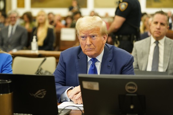 epa10938489 Former US President Donald Trump sits in court during his civil fraud trial at the Supreme Court of the State of New York, in New York, New York, USA, October 25, 2023. Trump, his adult sons and the Trump…