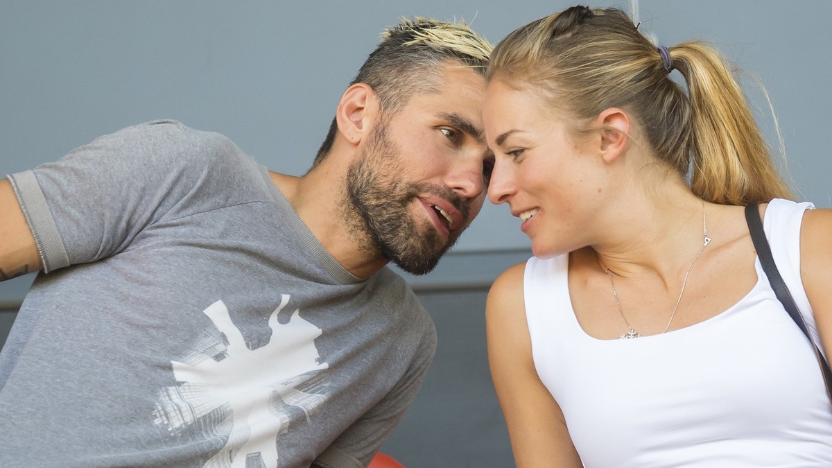Sion's soccer player Valon Behrami, left, talks to his wife Lara Gut-Behrami, right, skier from Switzerland during a friendly soccer match between FC Sion from Switzerland and Valencia CF from Sp ...