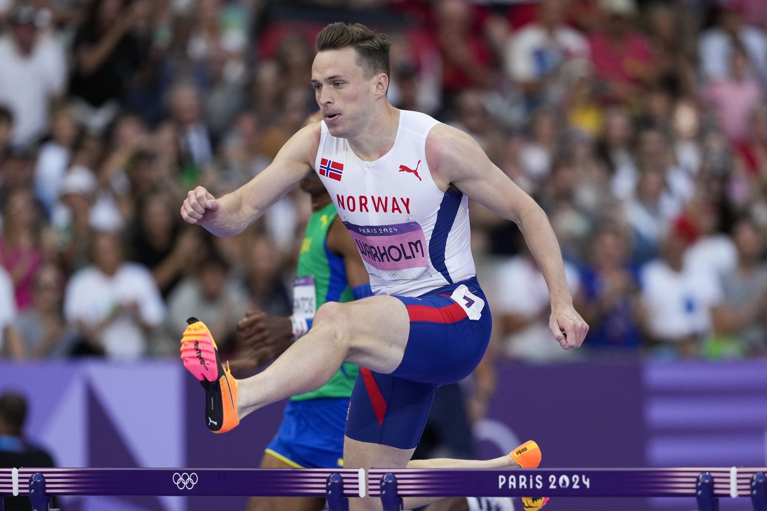 Karsten Warholm, of Norway, competes during the men&#039;s 110-meter hurdles semifinal at the 2024 Summer Olympics, Wednesday, Aug. 7, 2024, in Saint-Denis, France. (AP Photo/Bernat Armangue)