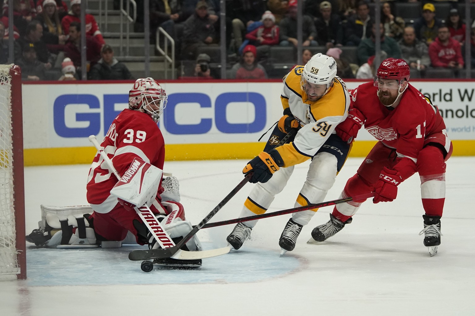 Nashville Predators defenseman Roman Josi (59) scores on Detroit Red Wings goaltender Alex Nedeljkovic (39) as Filip Hronek (17) defends in the first period of an NHL hockey game Tuesday, Dec. 7, 2021 ...