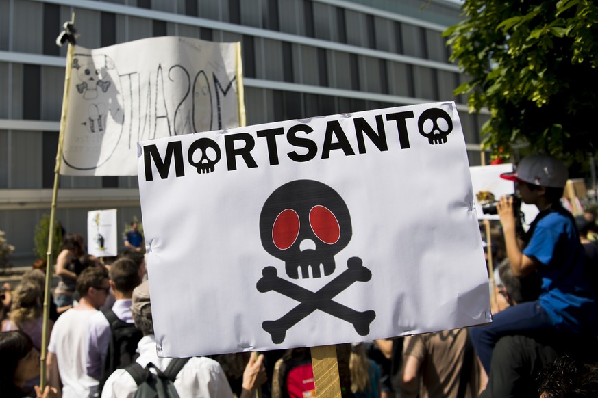 Protesters during their march against the multinational agrochemical and agricultural biotechnology companies Monsanto and Syngenta in front of the headquarter of the entreprise Monsanto, for Europe,  ...