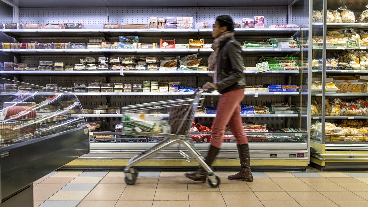 A customer pushes a supermarket trolley past the refrigerated shelf, pictured on March 5, 2013, at the Migros branch in Baden, Switzerland. Migros is Switzerland's the largest retail company. (KE ...