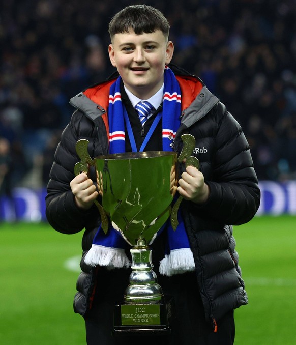 Darts player Mitchell Lawrie parades his trophy to the crowd at half time during the William Hill Scottish Premiership match at Ibrox Stadium, Glasgow. Rangers v Kilmarnock - William Hill Scottish Pre ...
