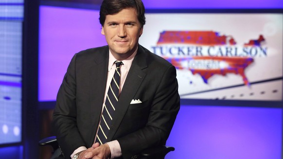 FILE - Tucker Carlson, host of &quot;Tucker Carlson Tonight,&quot; poses for photos in a Fox News Channel studio on March 2, 2017, in New York. Carlson&#039;s belittling of a reporter for The New York ...