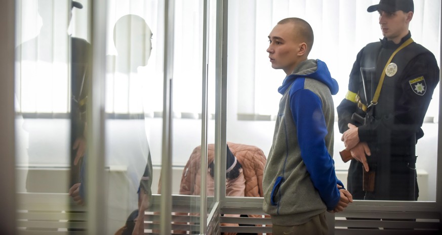 epa09957743 Russian serviceman Vadim Shishimarin stands in the dock on the second day of his war crimes trial in the Solomyansky district court in Kyiv, Ukraine, 19 May 2022. Prosecutors requested a l ...