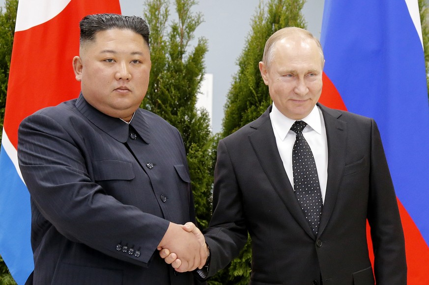 FILE - Russian President Vladimir Putin, right, and North Korea&#039;s leader Kim Jong Un shake hands during their meeting in Vladivostok, Russia, on April 25, 2019. (AP Photo/Alexander Zemlianichenko ...