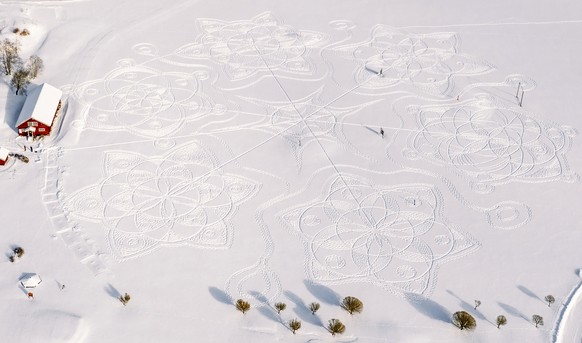 Part of a giant complex geometric pattern formed from thousands of footsteps in the snow near the capital Helsinki, in Espoo, Finland, Monday Feb. 8, 2021. The art work design measuring about 160 mete ...