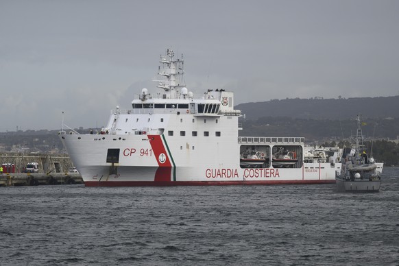 The Diciotti Italian Coast Guard vessel enters the port of Reggio Calabria, southern Italy, Wednesday, March 15, 2023. The Diciotti vessel transferred almost 600 recently rescued migrants to Reggio Ca ...