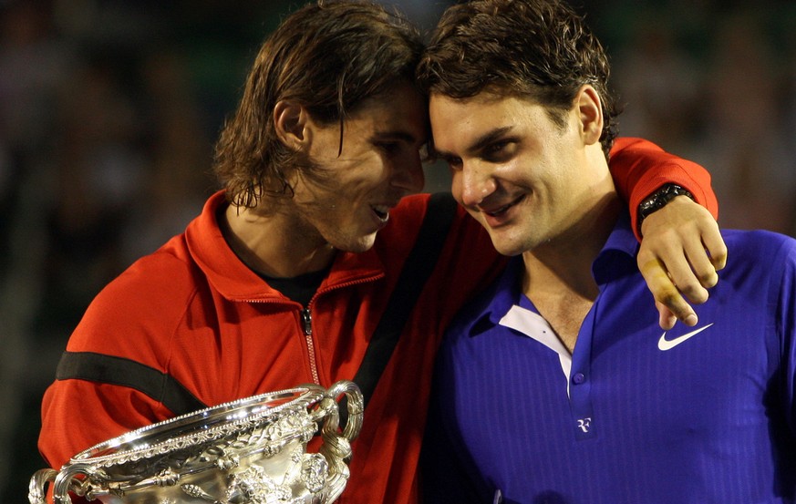 Spain&#039;s Rafael Nadal, left, hugs Switzerland&#039;s Roger Federer during the awarding ceremony after winning the Men&#039;s singles final match at the Australian Open Tennis Championship in Melbo ...