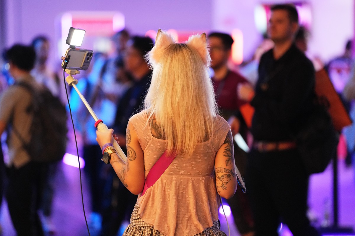 Social media influencer and live streamer Kunshikitty walks through the exhibition halls during the opening of Gamescom, the world's biggest gaming event and most important business platform for  ...
