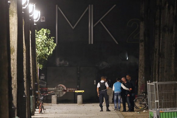 Police officers work on the scene of a knife attack in Paris, Monday, Sept. 10, 2018. A several people were injured in a knife attack in central Paris late Sunday but police said that terrorism was no ...