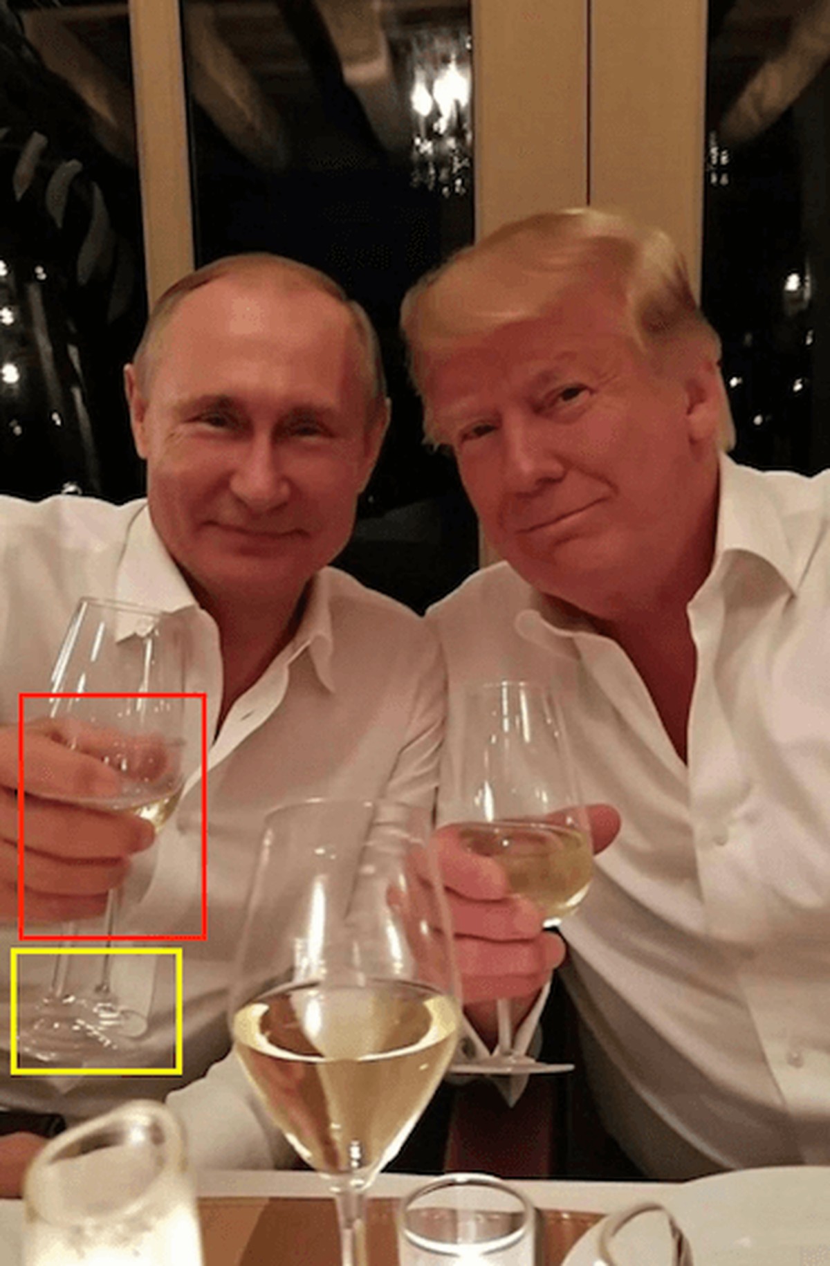 Bei genauerem Betrachten ist erkennbar, dass dieses Bild manipuliert sein muss – Putins Weinglas hat zwei Stiele und seine Finger sehen unnatürlich aus.