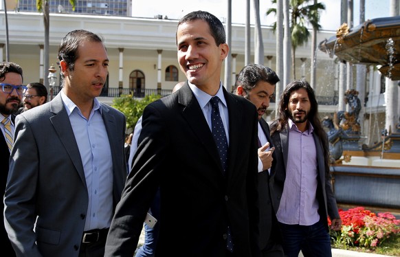 epa07329770 The president of the Venezuelan National Assembly Juan Guaido (C), arrives at the Parliament headquarters, in the Federal Legislative Palace, in Caracas, Venezuela, 29 January 2019. The Pa ...