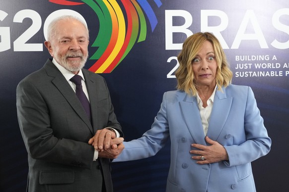Brazil&#039;s President Luiz Inacio Lula da Silva, left, shakes hands with Italian Prime Minister Giorgia Meloni, during a bilateral meeting a day before the opening of the G20 Summit, in Rio de Janei ...