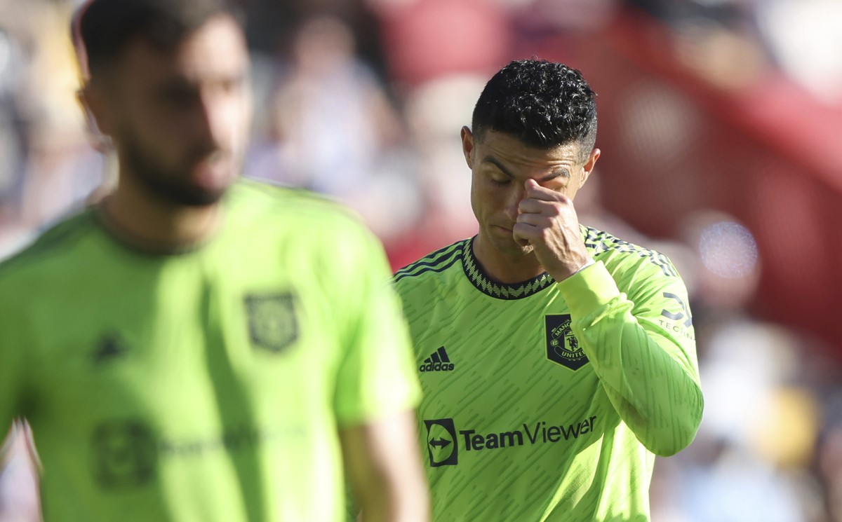 Manchester United's Cristiano Ronaldo right reacts as his team lose another goal to Brentford during the English Premier League soccer match between Brentford and Manchester United at the Gtech C ...