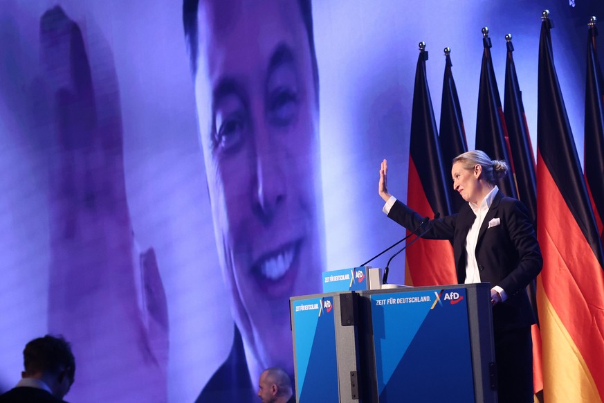 epa11852259 Alternative for Germany (AfD) party and faction co-chairwoman and top candidate for the federal election Alice Weidel talks online to Elon Musk during her speech during election campaign l ...