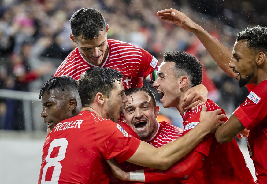 Switzerland&#039;s Breel Embolo, left, celebrates with Remo Freuler, Granit Xhaka, Xherdan Shaqiri, Ruben Vargas, and Djibril Sow, left to right, after scoring the second goal for Switzerland during t ...