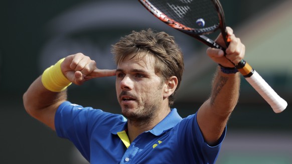 Switzerland&#039;s Stan Wawrinka celebrates winning his fourth round match of the French Open tennis tournament against France&#039;s Gael Monfils in three sets 7-5, 7-6 (9-7), 6-2, at the Roland Garr ...