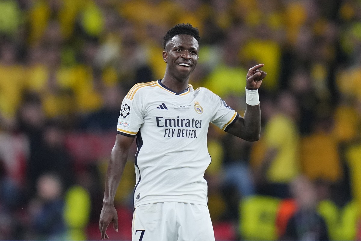 Real Madrid's Vinicius Junior celebrates after scoring his side's second goal during the Champions League final soccer match between Borussia Dortmund and Real Madrid at Wembley stadium in L ...