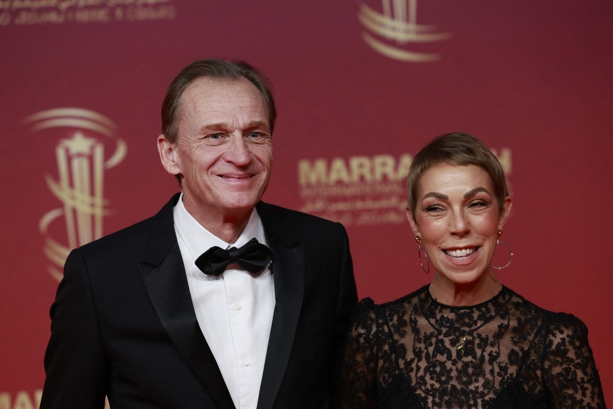 (FILES) French film producer Nicolas Altmayer (L) and Director of Public Relations for Dior Couture Mathilde Favier, pose on the red carpet on the second day of the 22nd edition of the Marrakech Inter ...