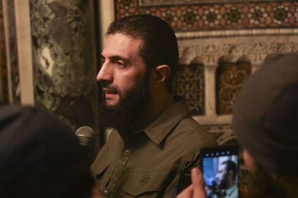 Abu Mohammed al-Golani speaks at the Umayyad Mosque in Damascus Sunday Dec. 8, 2024. Golani, a former al-Qaida commander who cut ties with the group and says he embraces pluralism and religious tolera ...