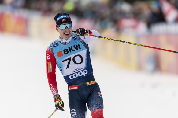 Simen Hegstad Krueger of Norway celebrates after winning the men&#039;s 15km free style competition at the Davos Nordic FIS Cross Country World Cup in Davos, Switzerland, on Sunday, December 12, 2021. ...