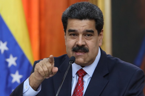 epa07319367 Venezuelan president, Nicolas Maduro, speaks during a press conference from Miraflores Palace, in Caracas, Venezuela, 25 January 2019. Maduro said that the international media that have co ...