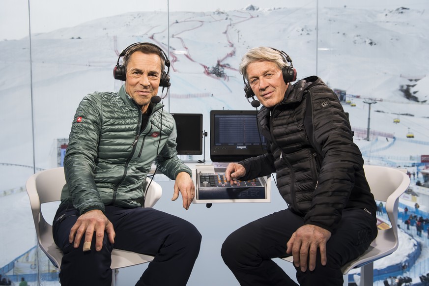 Matthias Hueppi, left, and Bernhard Russi, right, commentators of the Swiss TV, SRF, pose in the studio during the 2017 FIS Alpine Skiing World Championships in St. Moritz, Switzerland, Tuesday, Febru ...