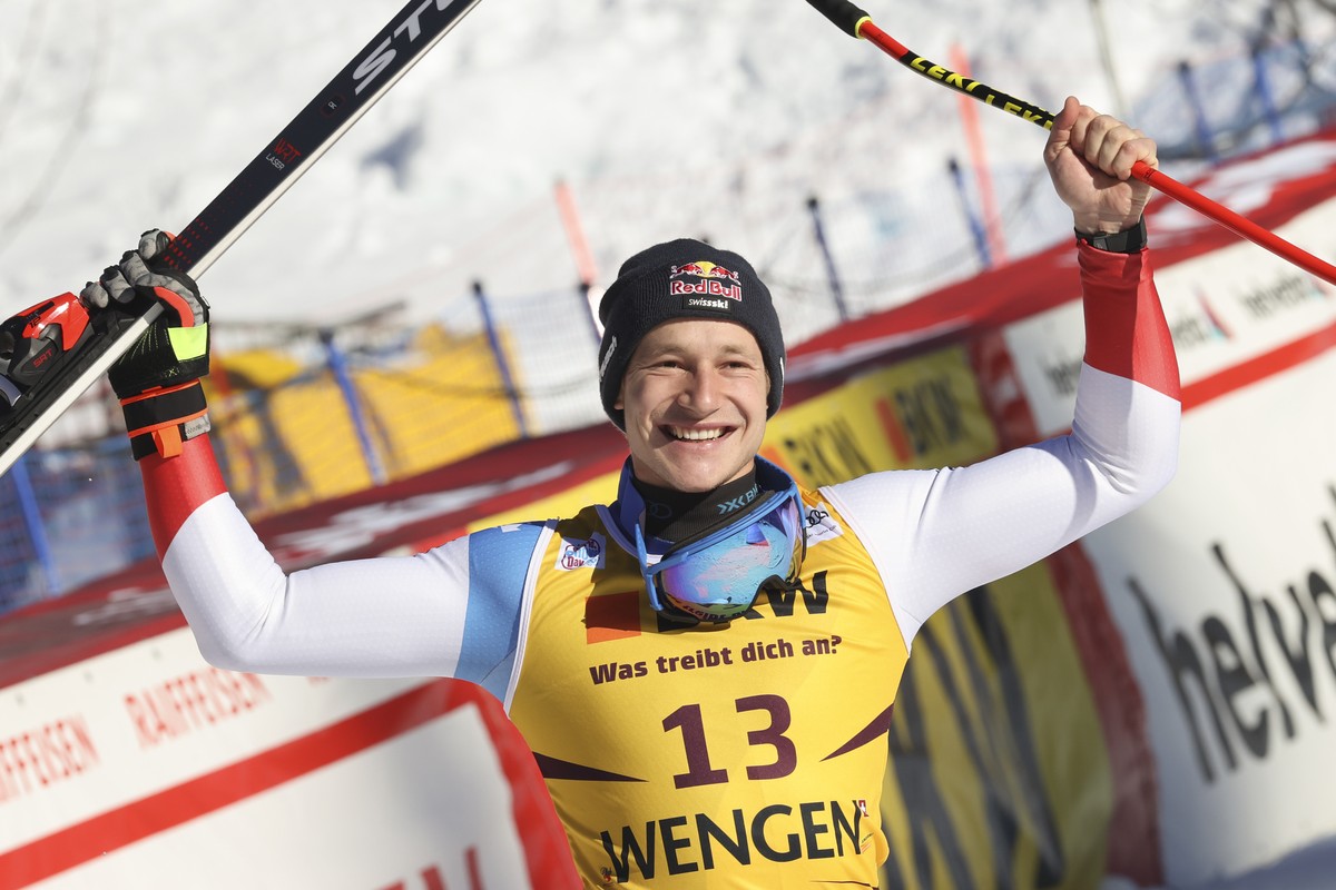Switzerland's Marco Odermatt celebrates taking second place in an alpine ski, men's World Cup downhill race, in Wengen, Switzerland, Friday, Jan. 14, 2022. (AP Photo/Luciano Bisi)