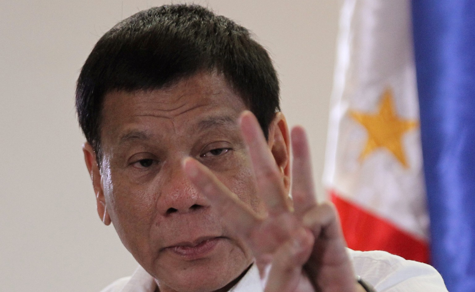 FILE PHOTO: Philippine President Rodrigo Duterte speaks upon his arrival at Davao International Airport in Davao city, Philippines, after returning from an APEC summit meeting in Peru, November 23, 20 ...