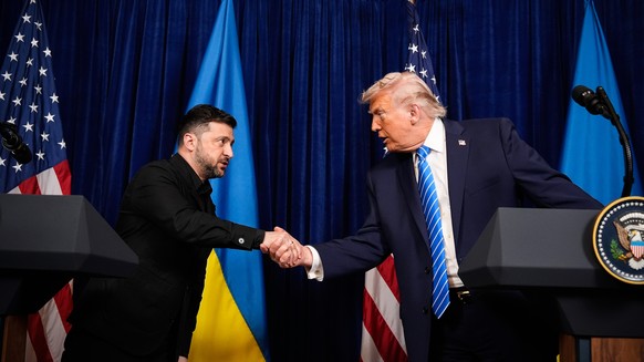 President Donald Trump and Ukraine's President Volodymyr Zelenskyy shake hands at the start of a joint news conference following a meeting at Trump's Mar-a-Lago club, Sunday, Dec. 28, 2025,  ...