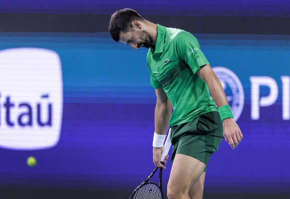 epa12000530 Novak Djokovic of Serbia reacts while in action against Jakub Mensik of Czechia during the Men?s Singles Final match at the 2025 Miami Open tennis tournament at the Hard Rock Stadium in Mi ...