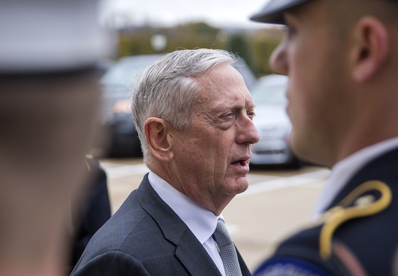 epa07163223 US Secretary of Defense Jim Mattis (C) speaks to the news media before meeting with Qatar Minister of State for Defense Dr. Khalid Al-Attiyah during an Enhanced Honor Cordon before a meeti ...