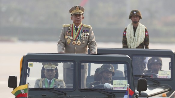 Senior General Min Aung Hlaing, left, head of the Military Council, inspects officers during a parade commemorating Myanmar's 78th Armed Forces Day in Naypyitaw, Myanmar, Monday, March 27, 2023. (A...