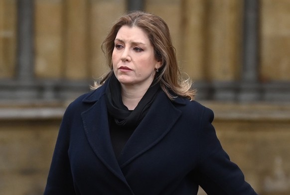 epa09720006 Conservative MP Penny Mordaunt (R) attends the funeral of Labour Party MP Jack Dromey at St Margret&#039;s Church in Westminster Abbey in London, Britain, 31 January 2022. Jack Dromey, was ...