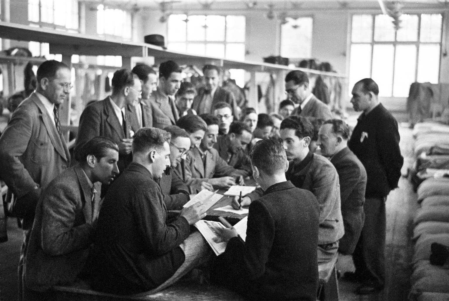 Jewish refugees from Germany or Austria play music at a refugee camp in Diepoldsau, Switzerland, pictured in Ausgust 1938. Jewish refugees in Switzerland were accommodated in refugee camps during the  ...
