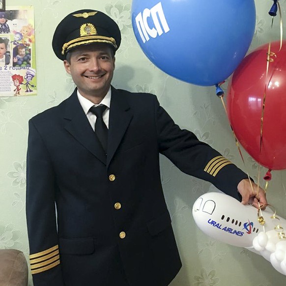 In this handout photo taken in 2018 and released by e1.ru , Damir Yusupov, 41, the captain of Ural Airlines A321pose for a photo in Yekaterinburg, Russia. The captain of a Russian passenger jet was ha ...